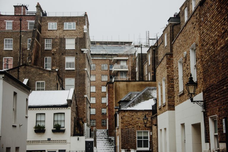 Brick facades of different buildings in London requiring retrofit to be energy efficient